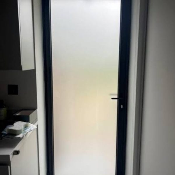 single hinged bronze aluminium door full pane with acid etched